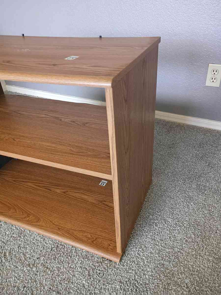a very beautiful brown wood TV stand which is very gorgeous