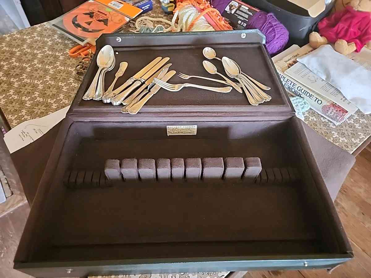 Silver silverware box with some silverware