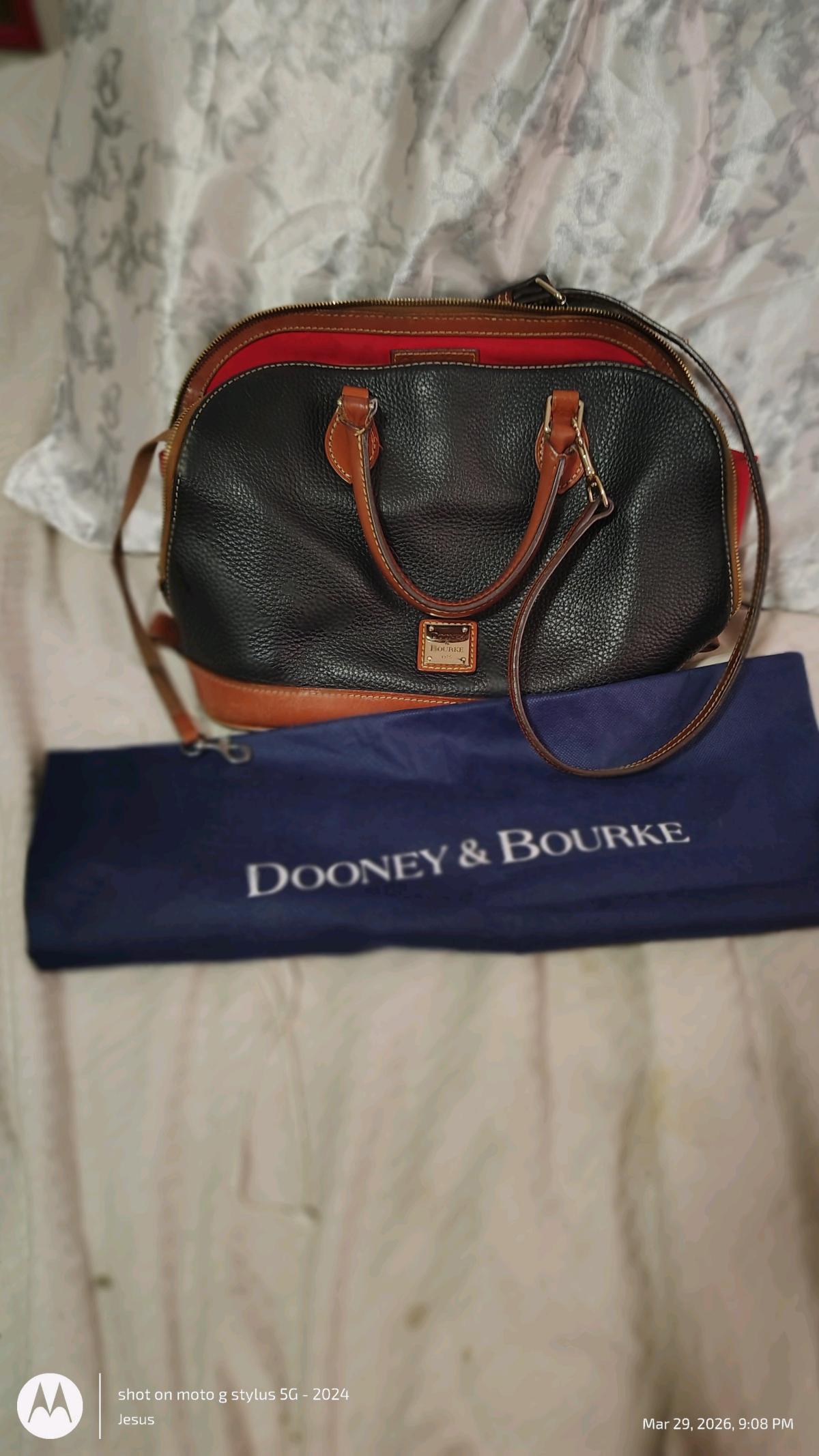 Dooney and Burke black purse with red in lining
