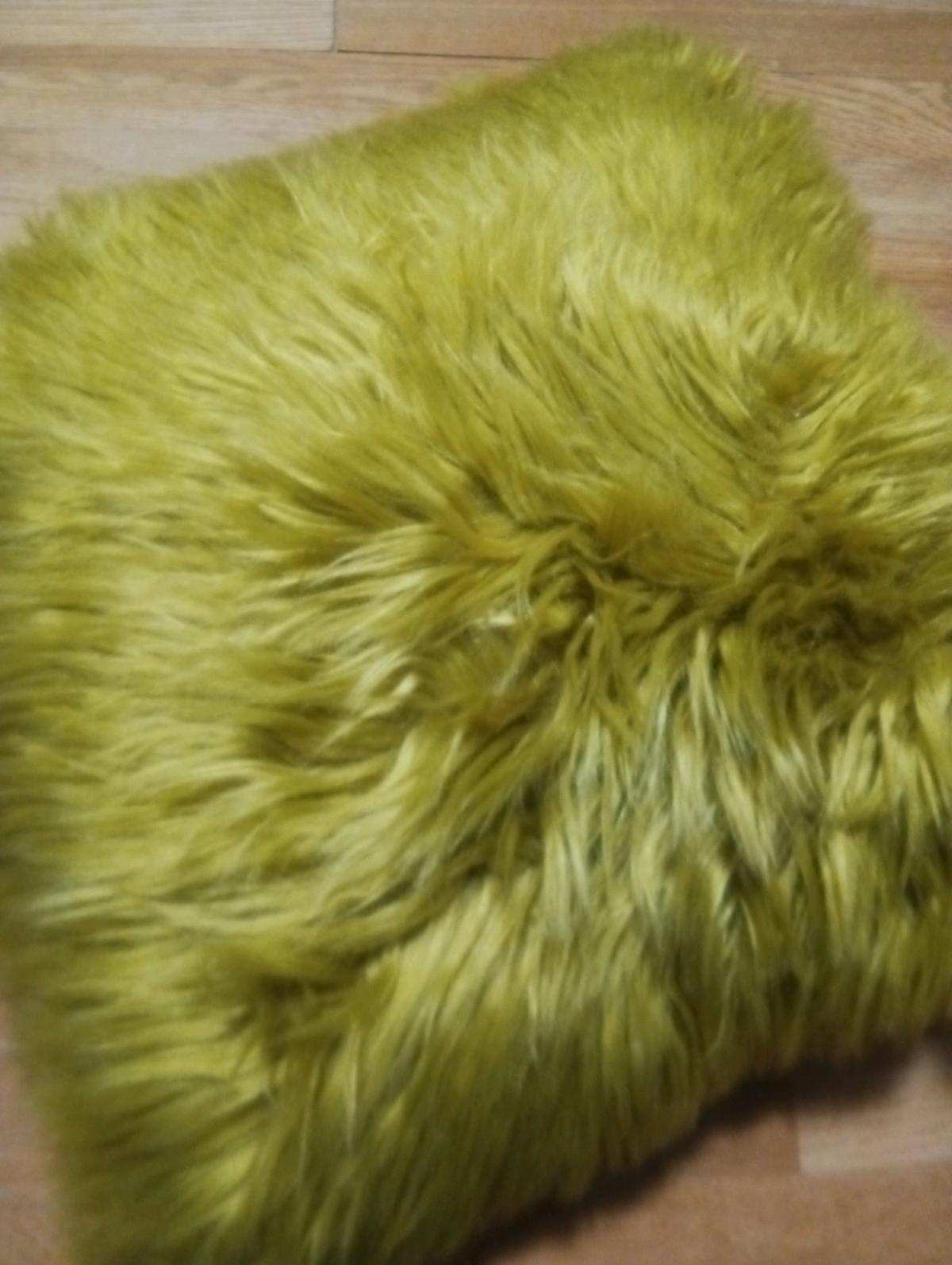 a golden fluffy pillow brand new never been used never been