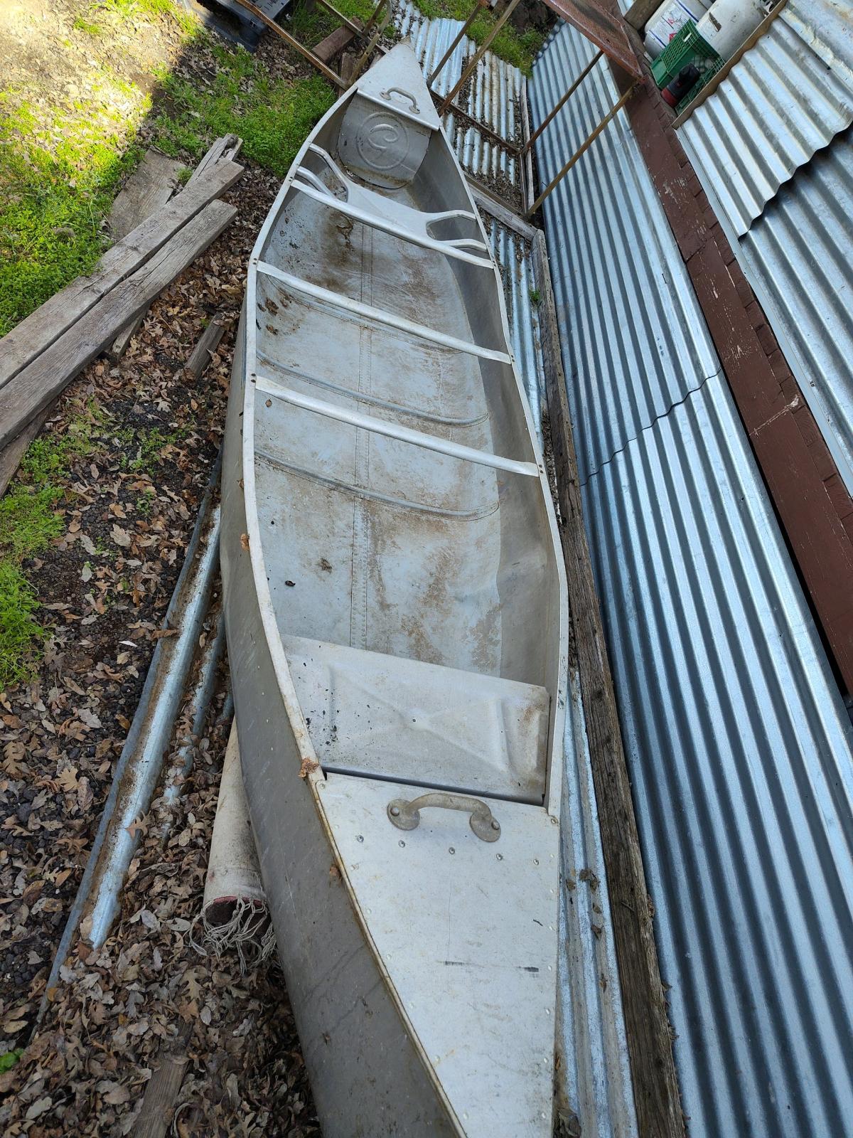 15 foot Grumman aluminum canoe fishing poles and tackle kit