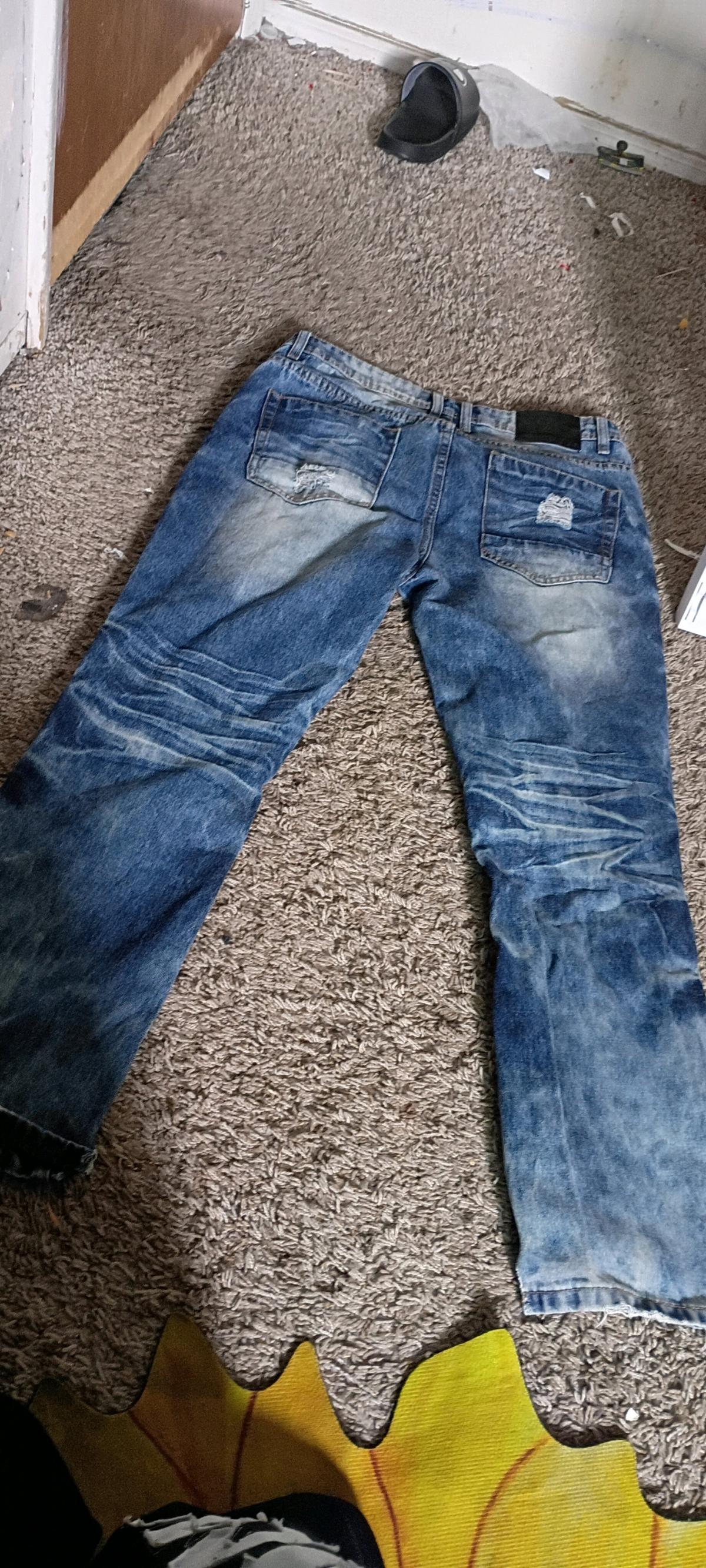 blue ripped jeans w paint splashes - Colorado Springs, Colorado - FleaMarketBay
