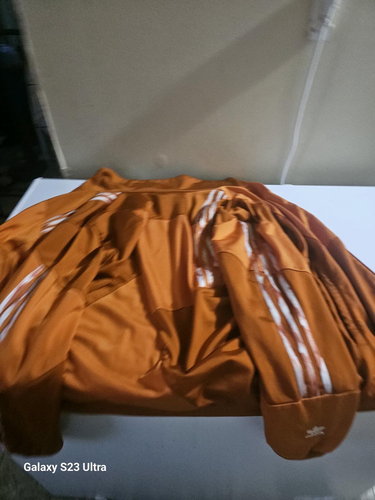 Adidas orange jacket with white stripes - Bloomington, Illinois - FleaMarketBay