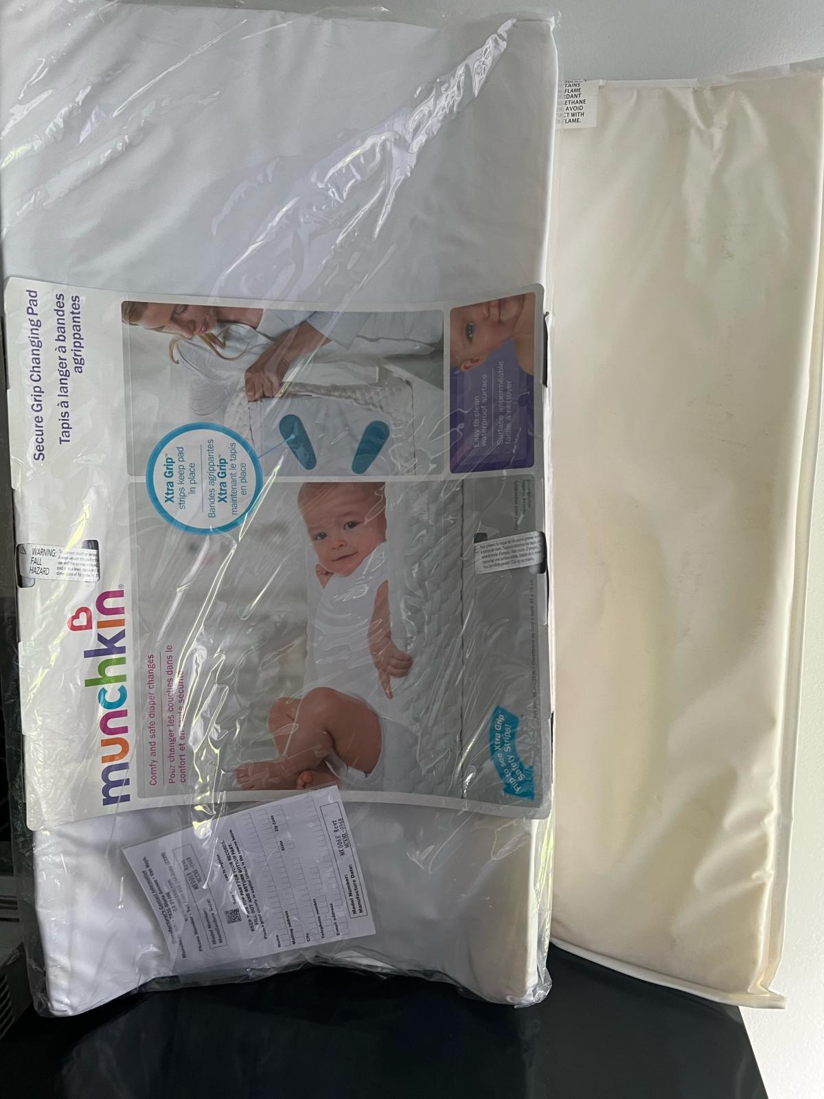 Munchkin changing pad new - Lynn, Massachusetts - FleaMarketBay