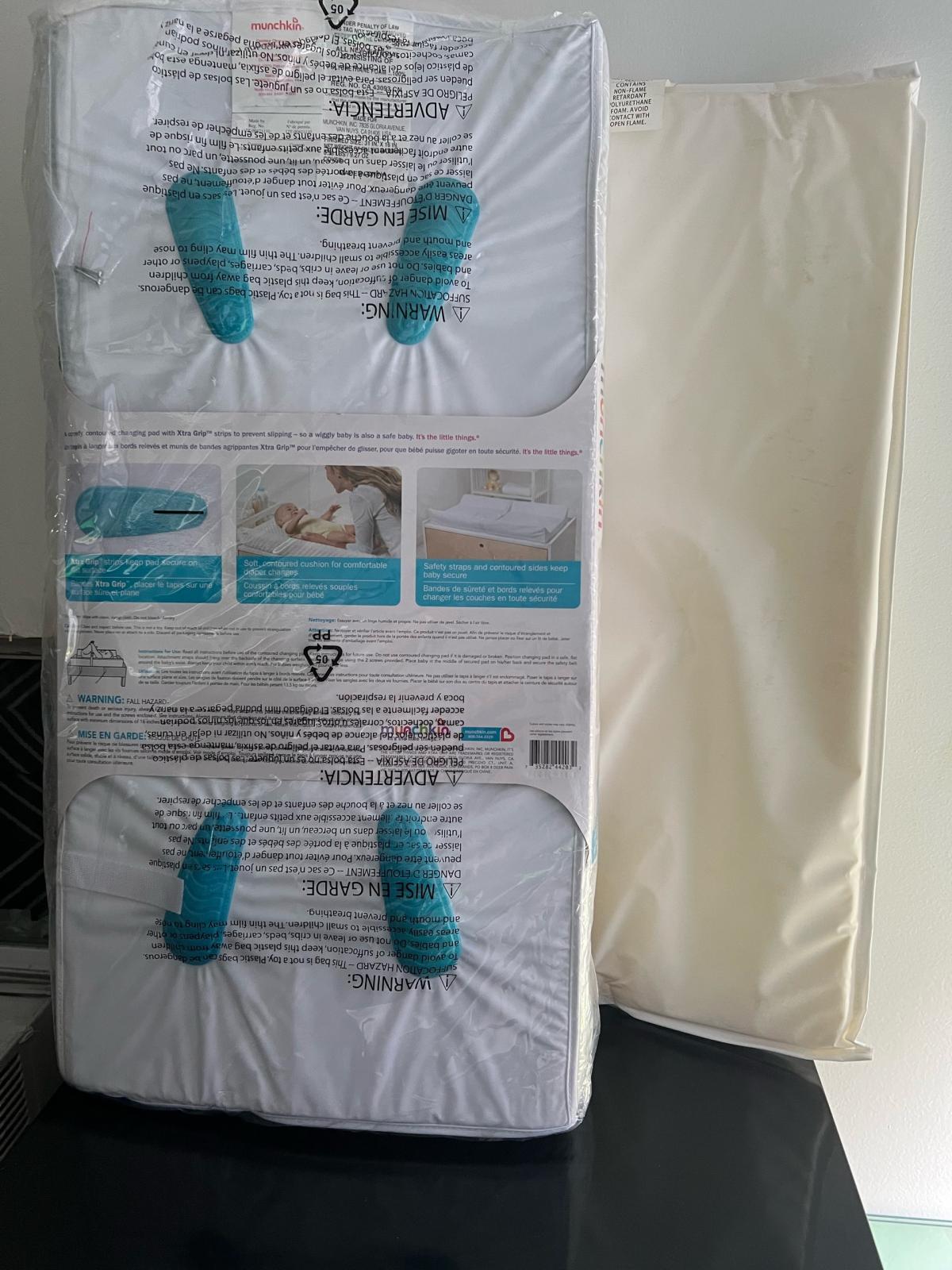 Munchkin changing pad new - Lynn, Massachusetts - FleaMarketBay