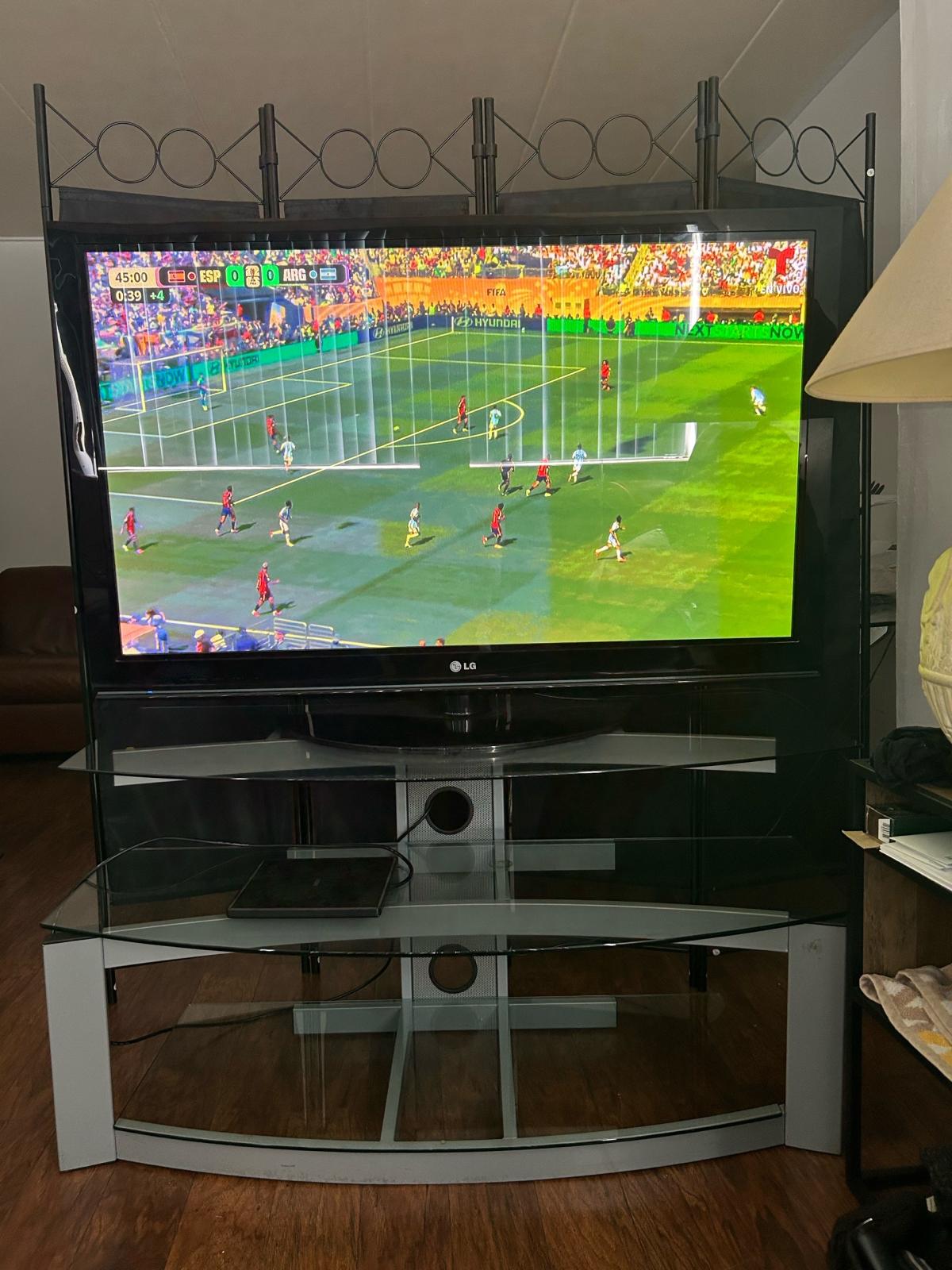 50LG smart TV with 3 tier metal and temper glass TV tablein - Hackensack, New Jersey - FleaMarketBay