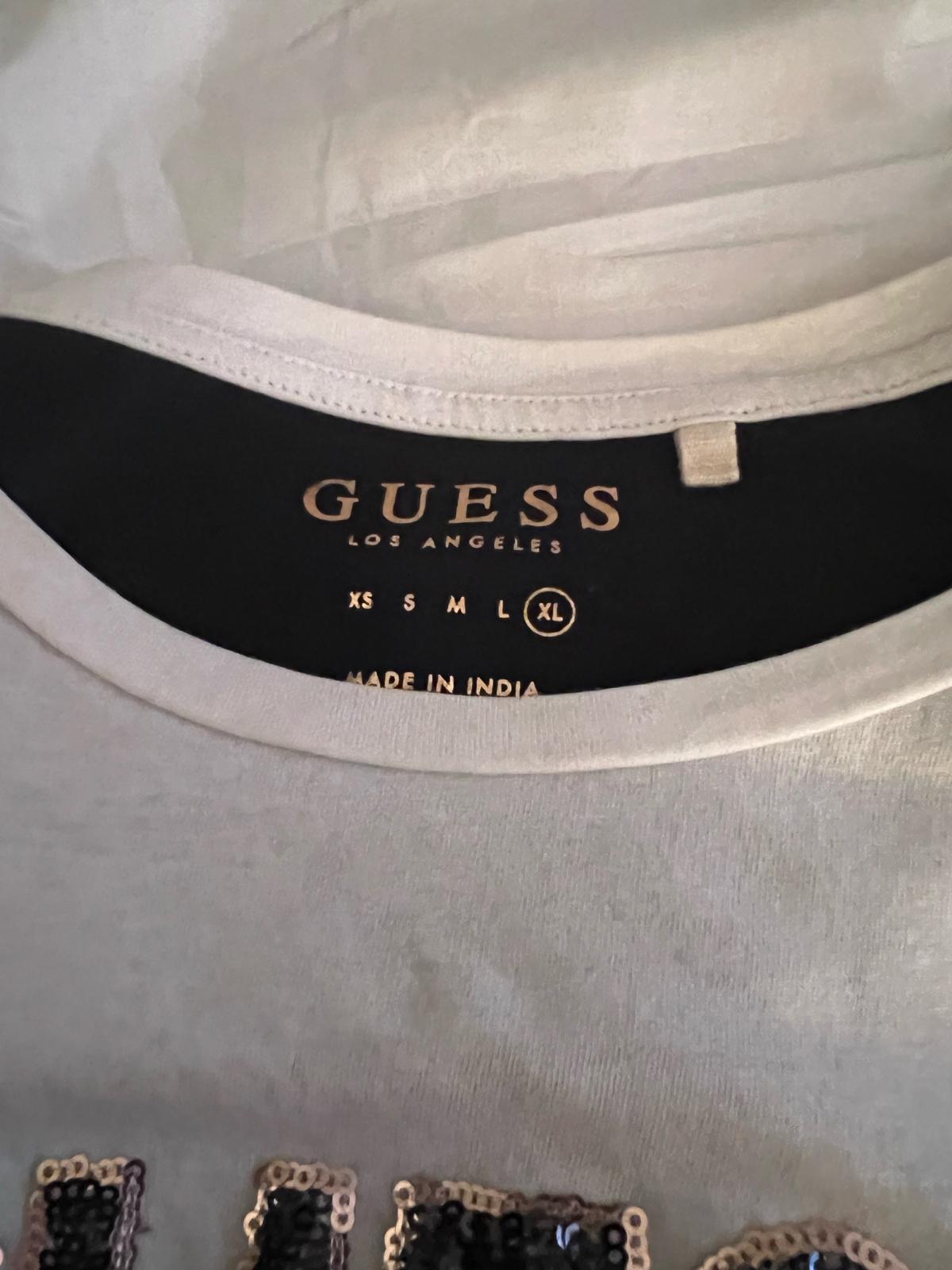 Guess lg T good condition - Lynn, Massachusetts - FleaMarketBay