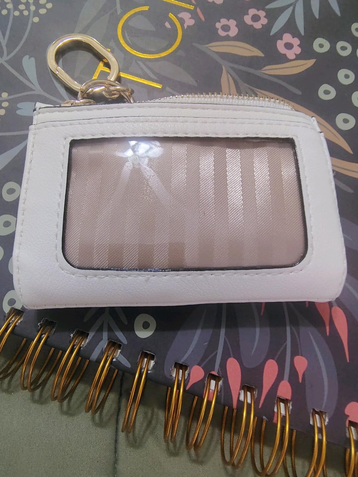 This is a white Victorias Secret foldover card case keychain - Rancho Santa Margarita, California - FleaMarketBay