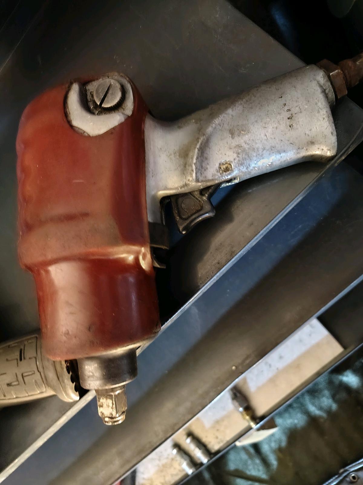 pneumatic tools with a few accessories and a vintage battery - Fountaintown, Indiana - FleaMarketBay
