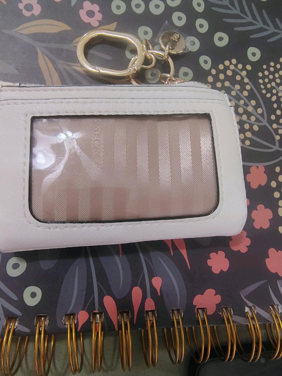 This is a white Victorias Secret foldover card case keychain - Rancho Santa Margarita, California - FleaMarketBay