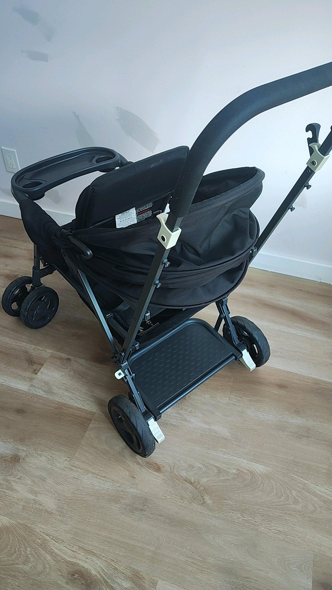 A Black Stroller built for 2 small children - Bronx, New York - FleaMarketBay