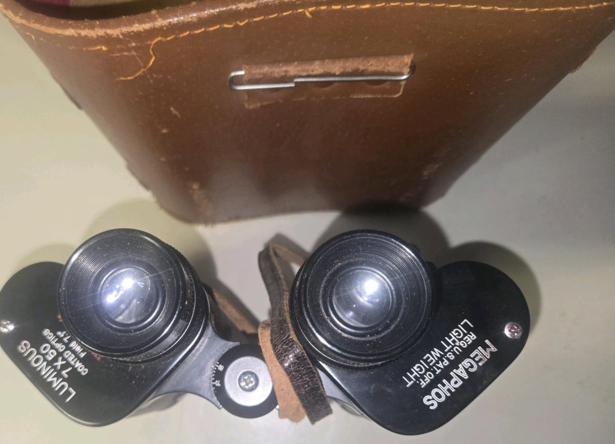 The image shows a pair of vintage black field binoculars wit - Linthicum Heights, Maryland - FleaMarketBay