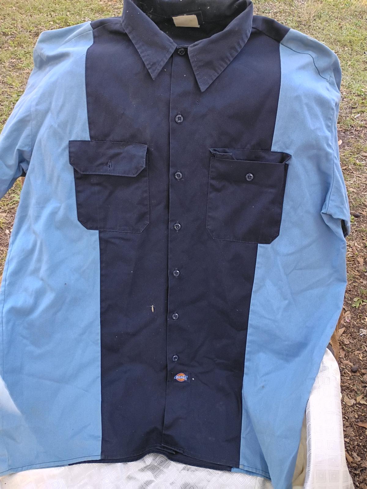 This is a Blu and Black Dickies Shirt Sleeve Top - Swansea, South Carolina - FleaMarketBay