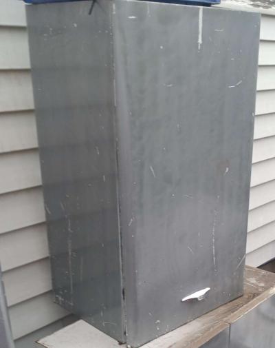 single door metal cabinet with built in shelf