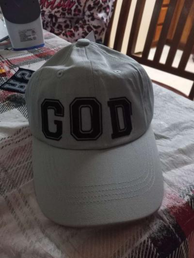 baseball cap that says God on it