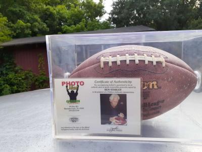 an autographed Ken Stabler football in an acrylic case