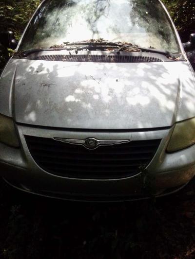 the 2003 Chrysler minivan Voyager for sale needs a little wo - Thumbnail 4