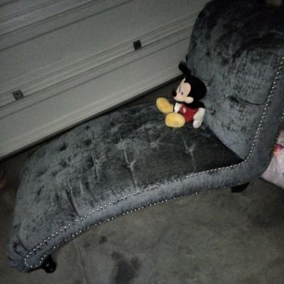 blue buttoned curvy tuffed sofa