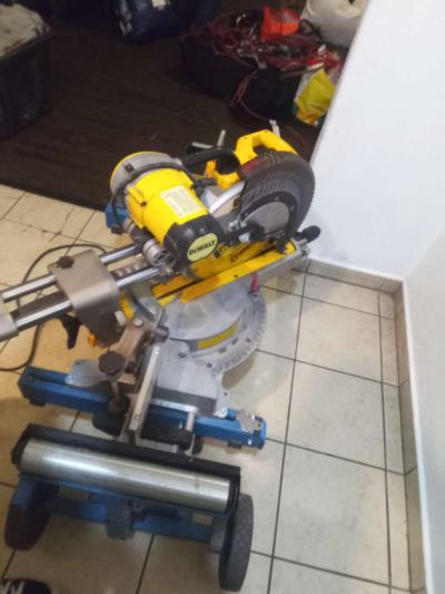 a DeWalt miter saw with table - Thumbnail 2