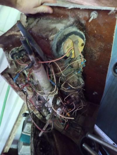 old boat parts and fishing poles and tackle