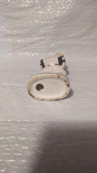 A Little Girl Playing an Accordion with a White Dress - Thumbnail 5