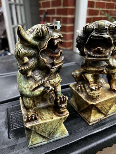 two hand carved statues