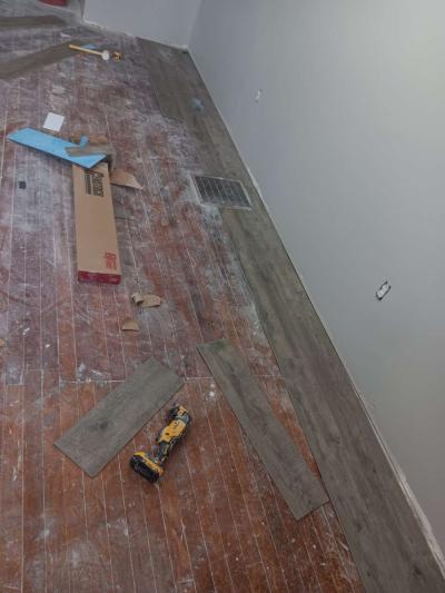 installation of pvc flooring tiles sidingh - Thumbnail 4