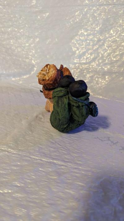 Resin Scarecrow Laying Down With Legs Bent Holding A Crow - Thumbnail 5
