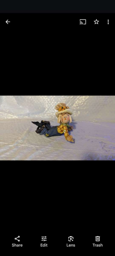 Resin Playful Scarecrow Laying On His Stomach With A Black C - Thumbnail 2