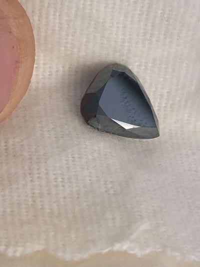 a nicely cut pearshaped black diamond - Thumbnail 2