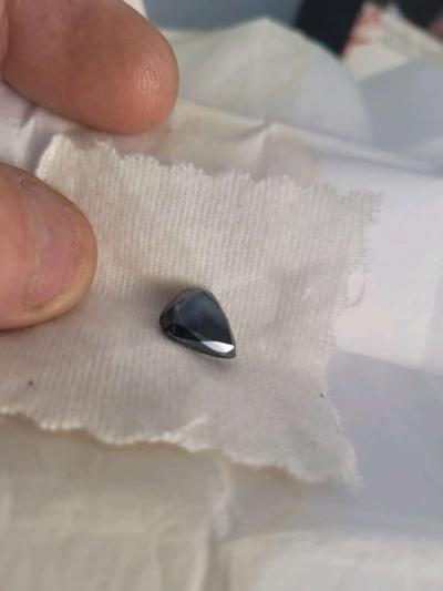 a nicely cut pearshaped black diamond - Thumbnail 3