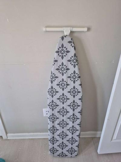 ironing board and iron and celebration glass