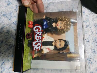 30 year of the movie Grease featuring Sandy and Danny dolls