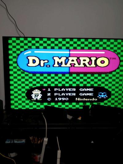 2 Nintendo NES consoles with 3 controllers and 5 games - Thumbnail 2