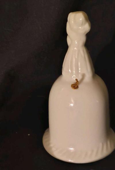 Girl standing on top of Bell - Thumbnail 2