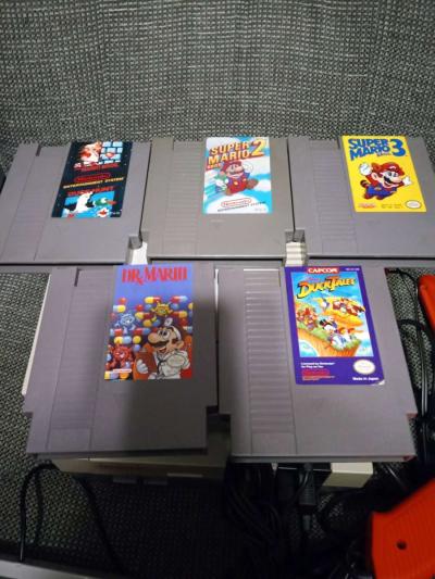 2 Nintendo NES consoles with 3 controllers and 5 games - Thumbnail 5