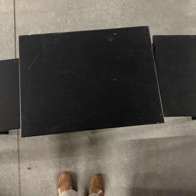 3 black tables slide under the other for easy storing used