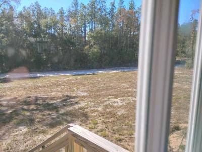 land and a single wide mobile home - Thumbnail 2