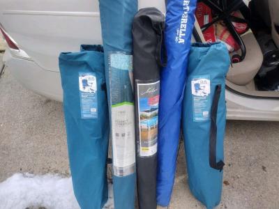 two chairs with canopies over the top three umbrellas 50 eac