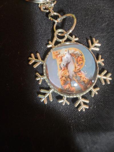 a snowflake pendant with a unicorn and the letter R - Thumbnail 5