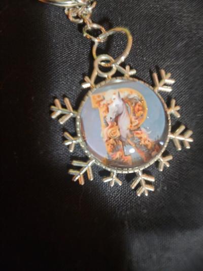 a snowflake pendant with a unicorn and the letter R - Thumbnail 6
