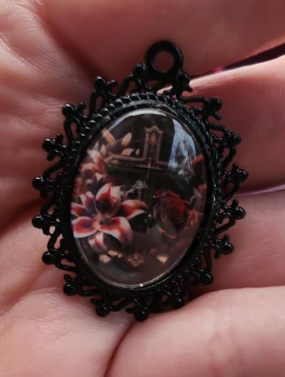 Cross n flowers in black pendant