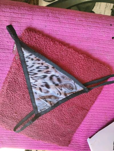 A Sexy Womans Pair of Black and Grey Leopard Thong Panties