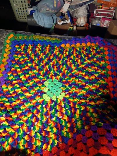 Multi colored crochet crib blanket