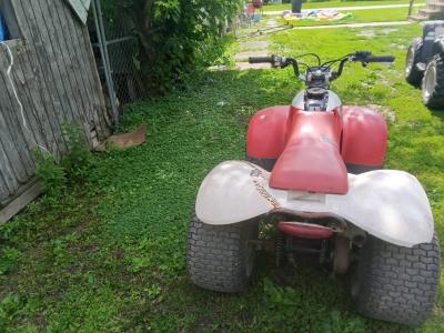 1985 red and white Honda four tax fourwheeler - Thumbnail 2