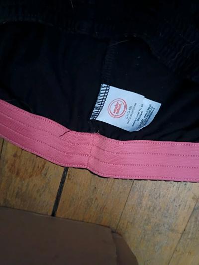black shorts with pink waist band