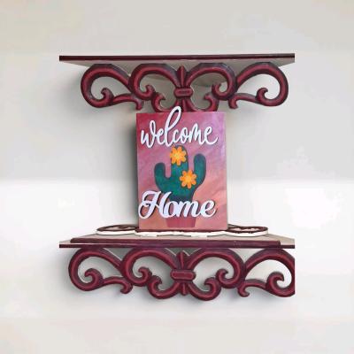 wood welcome home sign with cactus desert sunset