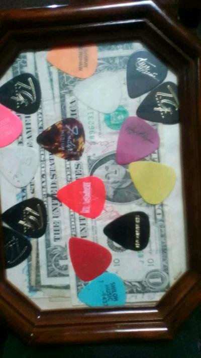 guitar picks from country singers and dollar fills singed