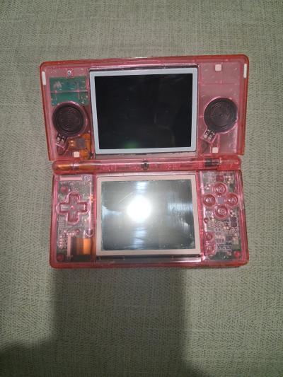 pink transparent Nintendo nes lite with 32gb memory card