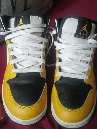 Yellow black and white Air Jordans
